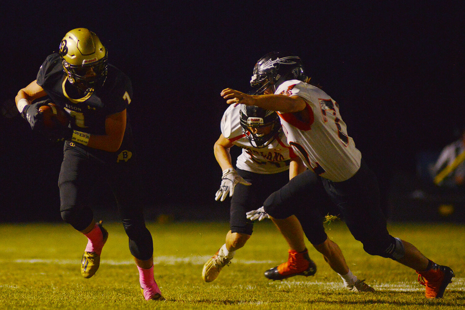 Gage Horetski moves down the line around a defender to gain a few yards